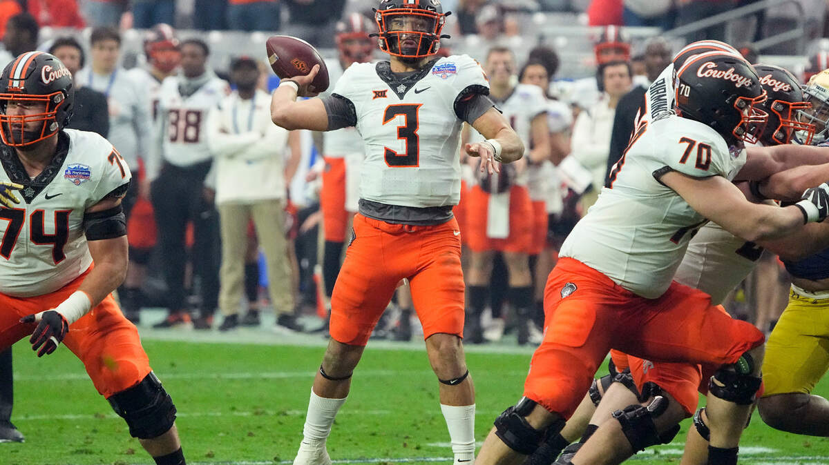 Oklahoma State quarterback Spencer Sanders (3) throws against Notre Dame during the first half of the Fiesta Bowl NCAA college football game, Saturday, Jan. 1, 2022, in Glendale, Ariz. Sanders has improved and leads an explosive offense. (AP Photo/Rick Scuteri)
