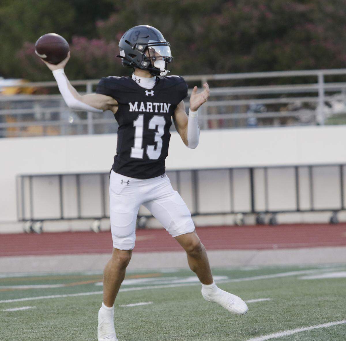 Arlington Martin’s Chase Devoll (13) throws a pass against Mansfield during their game on Thursday, September 11, 2025 at Maverick Stadium in Arlington Texas.