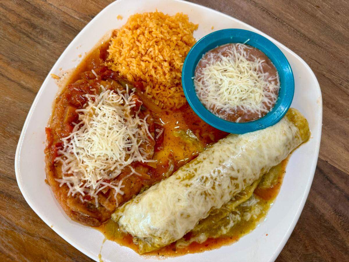 A chile relleno with an oversized green chicken enchilada at Chalio in Fort Worth, Aug. 10, 2024.