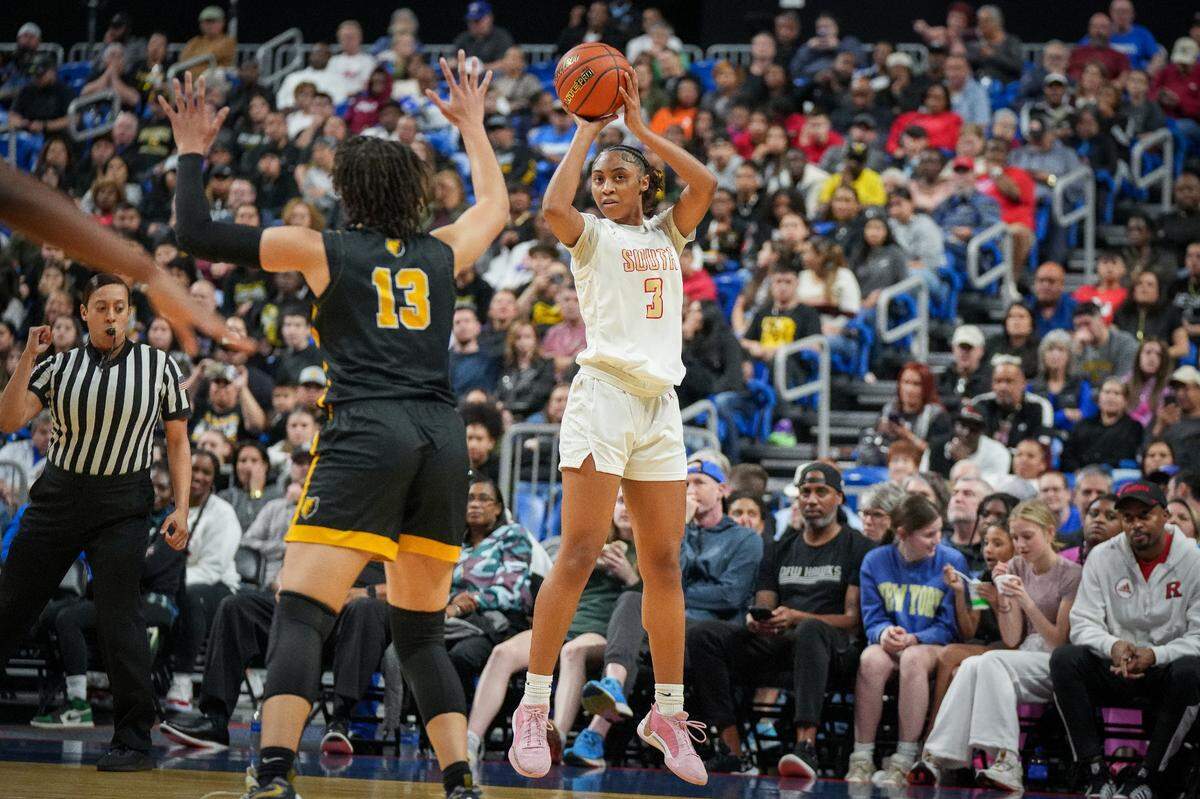 South Grand Prairie’s Taylor Barnes (3) shoots a three against San Antonio Brennan’s Taylor Ross in a Class 6A state semifinal on Friday, March 1, 2024 at the Alamodome in San Antonio, Texas. SGP defeated Brennan 53-42.