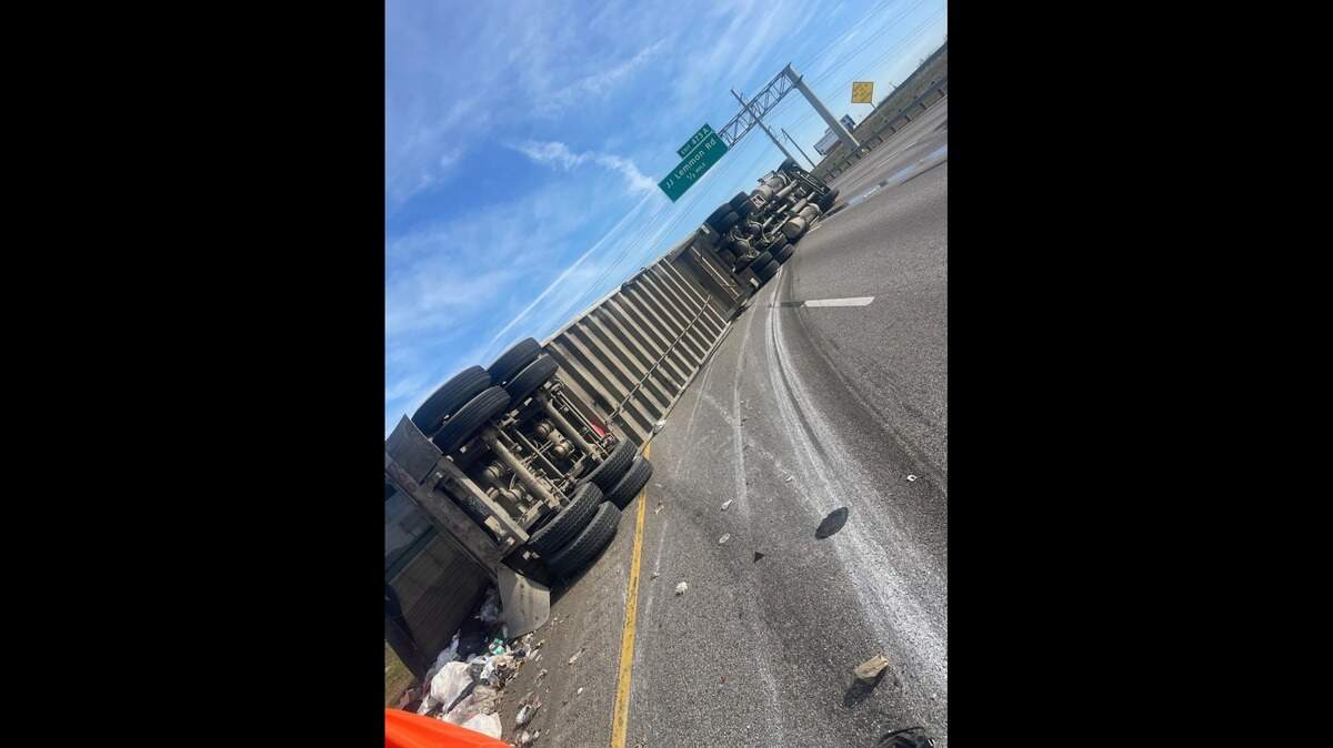 An overturned 18-wheeler closed three out of four eastbound lanes of Interstate 20 in Dallas on Friday, Dec. 19. Officials say it will take several hours to clear the highway.