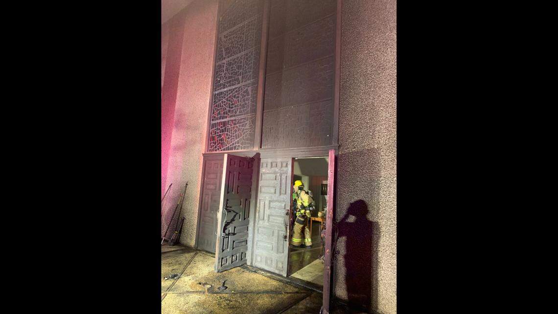 Firemen at the site of the fire on Oct. 31. They later determined the incident to arson.