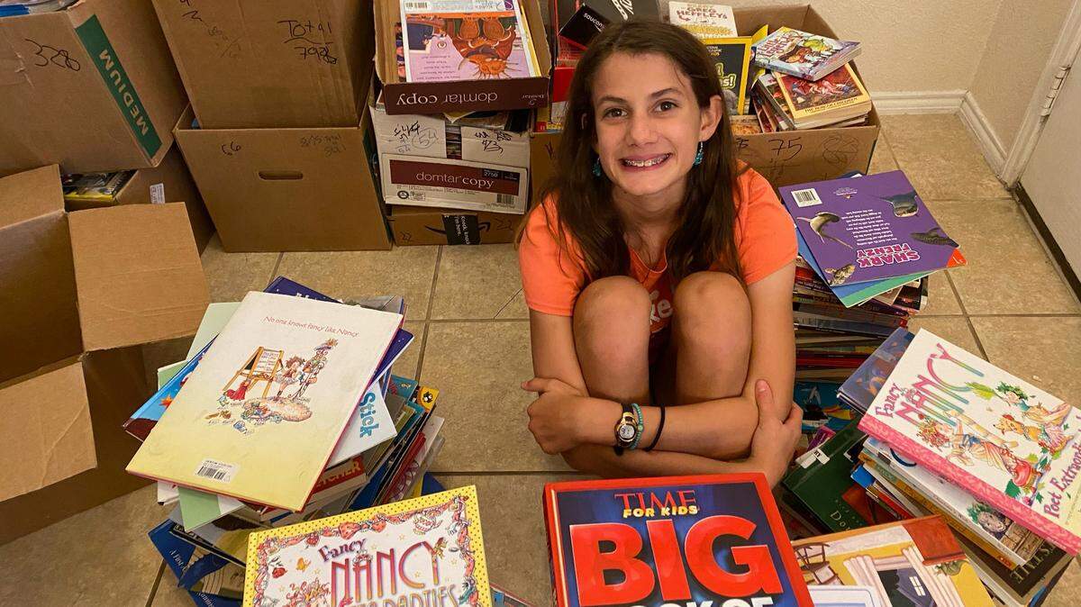 Natalie Strausz, a seventh-grader at Trinity Valley School, has collected over 1,000 picture books to help teachers.