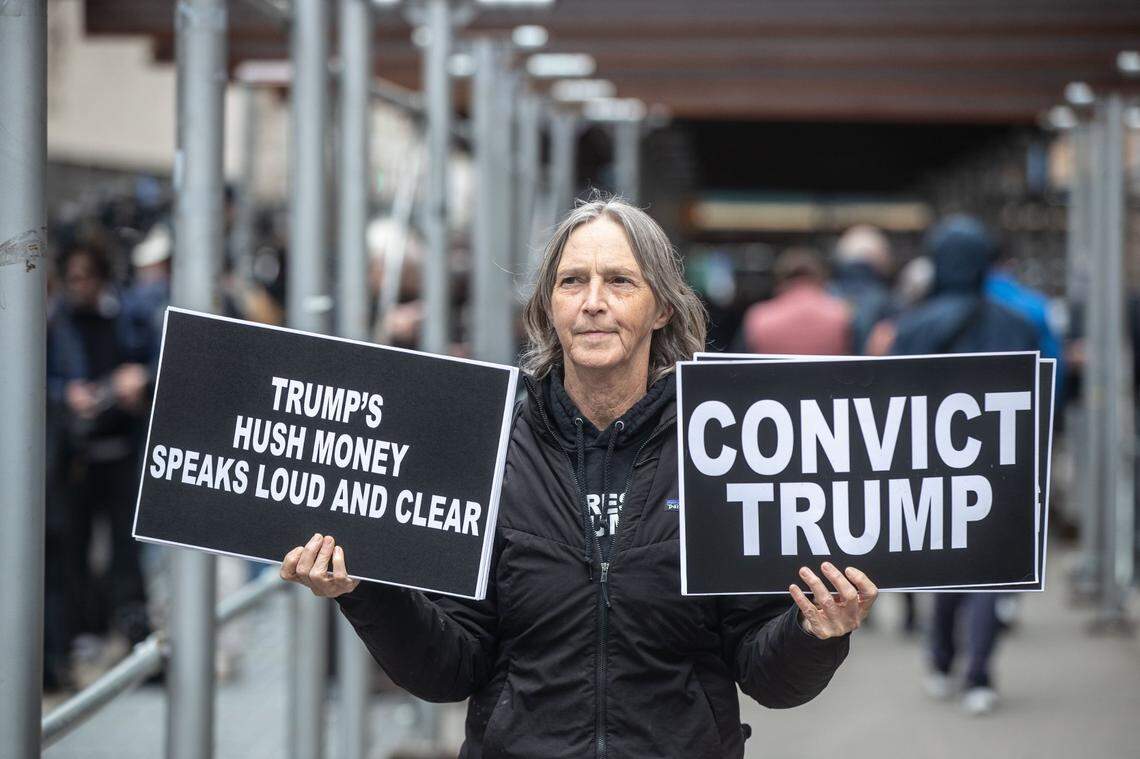 March 27, 2023; New York, NY, USA; Lisa Fithian of New York City, an anti-Trump protestor stands near the Manhattan Criminal Courthouse March 27, 2023, where a grand jury is hearing witness testimony related to the former President paying hush money to a former porn actress. Mandatory Credit: Seth Harrison-USA TODAY NETWORK