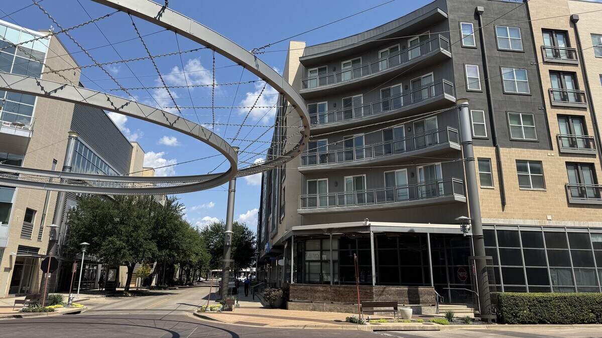 An empty corner space at Currie and Crockett streets in the Artisan Circle development of Fort Worth, off West Seventh Street. The space, formerly Cork & Pig Tavern until 2020, is the future site of Henry McCarthy Irish Pub, according to a permit filed with the city.