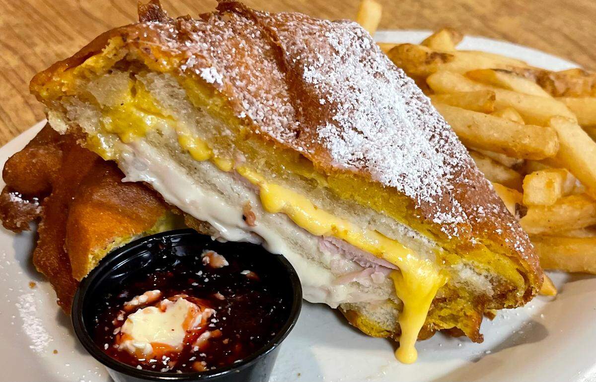 A turkey-ham “Big Tex” Monte Cristo with two cheeses and lingonberries at the Ol’ South Pancake House in Burleson.