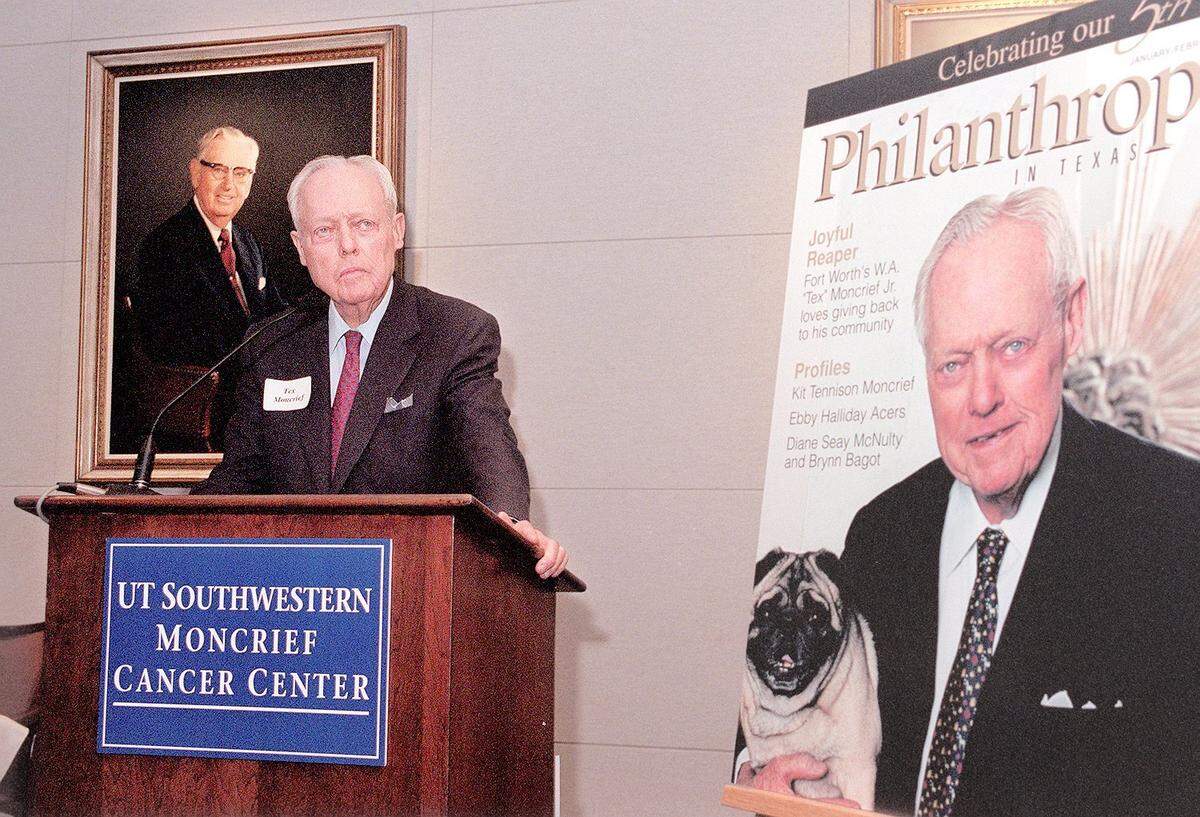 William Alvin “Tex” Moncrief Jr. stands at the podium as the UT Southwestern Moncrief Cancer Center honors the Moncrief family on Jan. 29, 2001, in Fort Worth, Texas. Moncrief, a Texas wildcatter who helped build a father-son venture into a multi-billion-dollar business over more than 70 years in the oil and gas industry, has died at age 101.