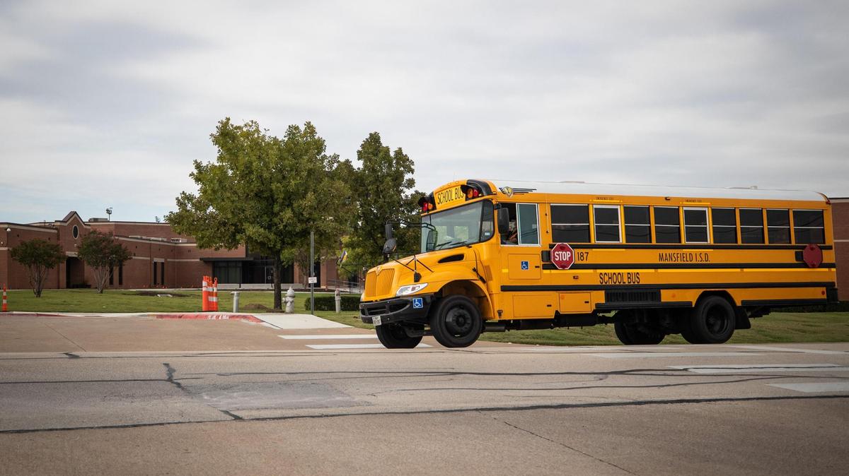 A school bus passes Summit High School in Mansfield in a 2020 archive photo. Mansfield school district officials investigated the circulation of a racist photo at Summit High School on Monday, according to a statement from the school district. 