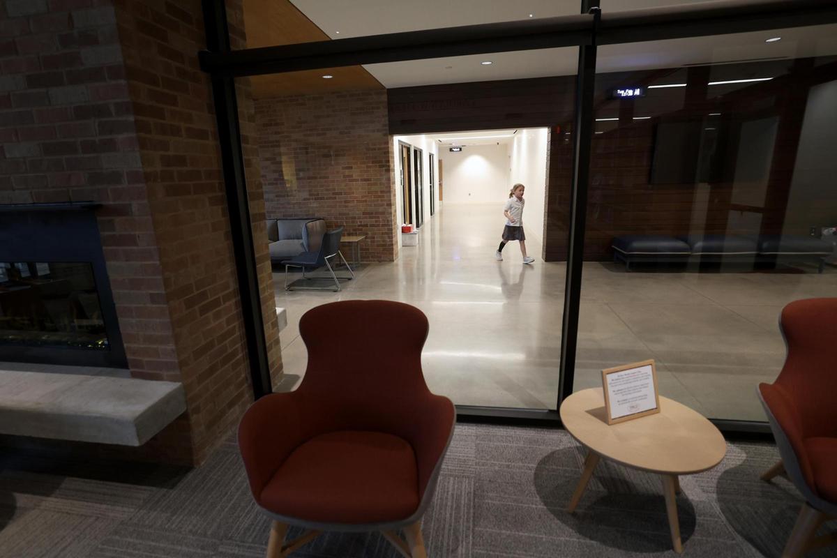 A student walks past the 2,002-square-foot library at the new Annie Richardson Bass Lower School at Fort Worth Country Day on Tuesday, Feb. 18, 2025.