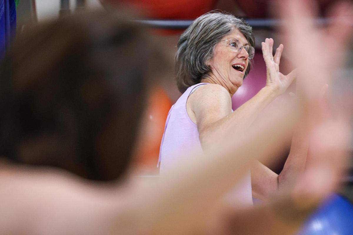 Patti Crummel does a fall prevention exercise during an exercise class at the Texas Health Southwest Fitness Center in Fort Worth.