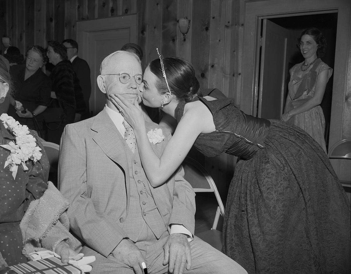 May 5, 1953: Mrs. Achilles Corcanges gives Dr. W.M. Campbell of Weatherford a congratulatory kiss