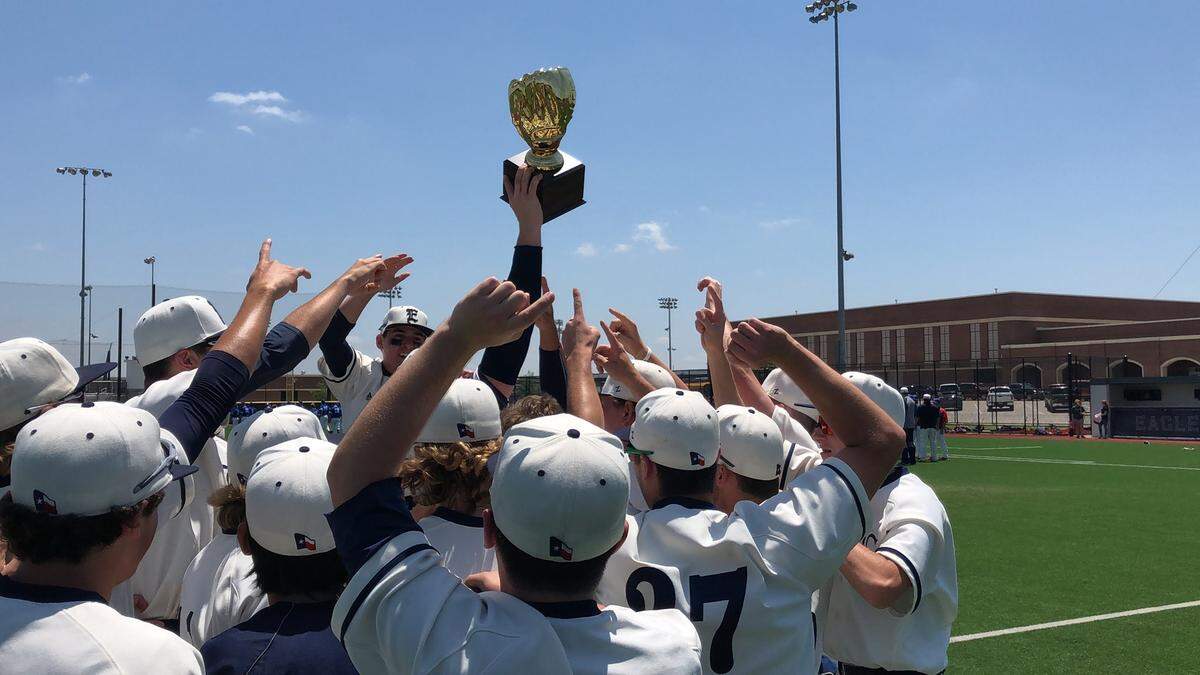 The Eaton baseball team celebrates its sweep over Grapevine to capture the trophy in the 5A Region I area round at Eaton high school, Saturday May 12, 2018.