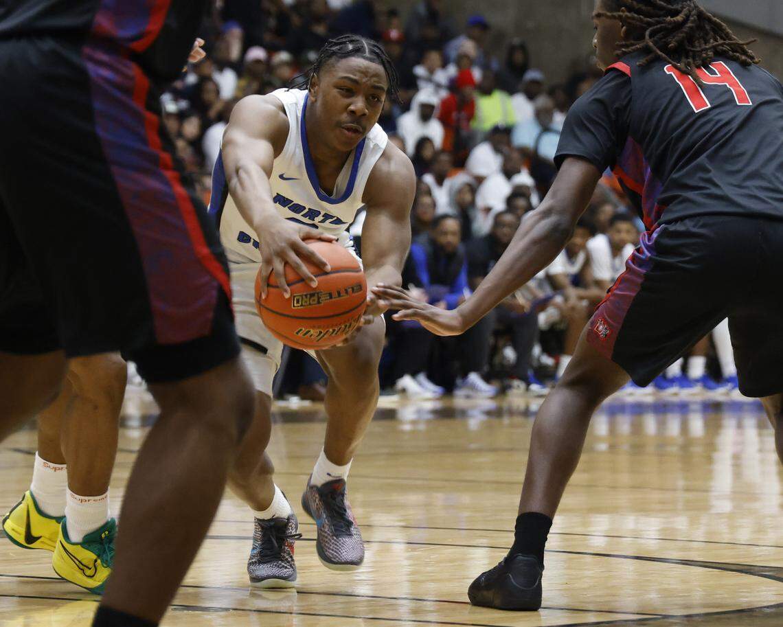 North Crowley guard Kameron Price (2) almost looses the ball between Duncanville guard Jirehn Mitchell (3) and forward Jairus Ingram (14) during the first half of a UIL Class 6A Division I boys semifinal basketball game at Wilkerson Greines Activity Center in Fort Worth, Texas, Monday, Mar. 10, 2026.