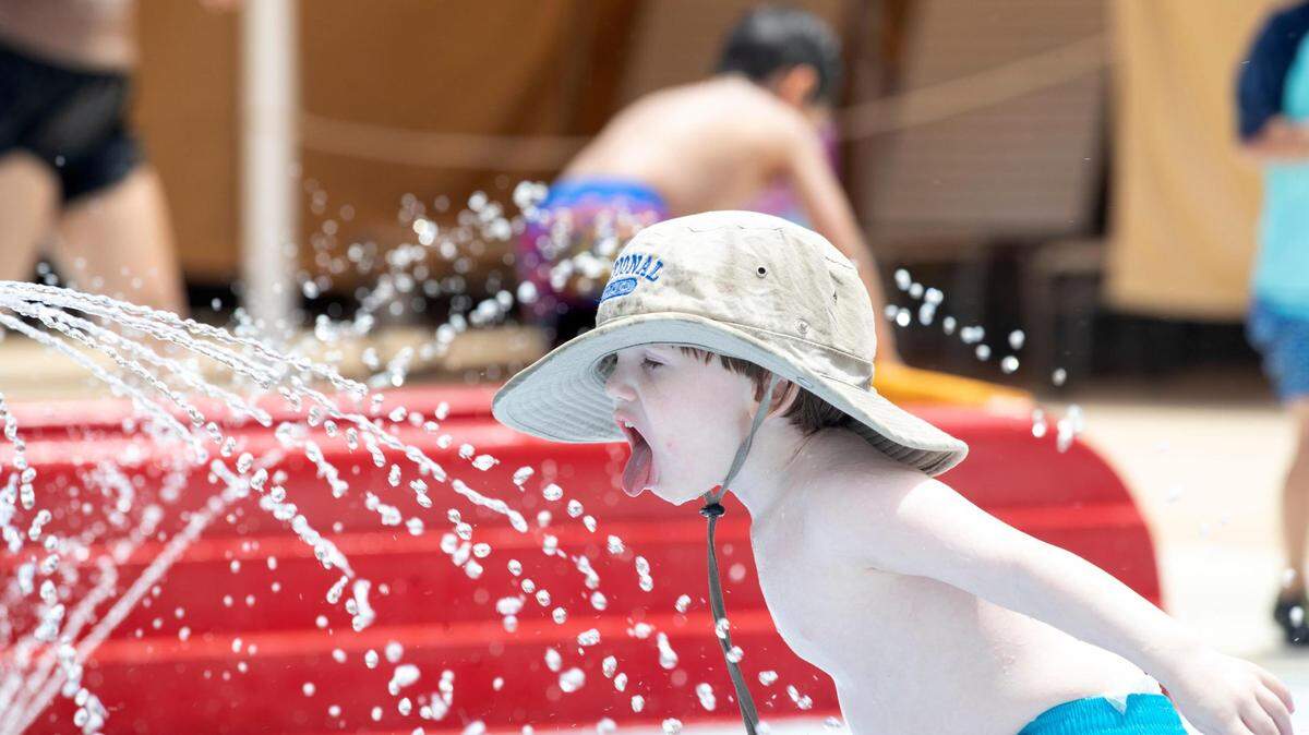 Mikhail Colbert, 4, cools off in the water park at the Fort Worth Zoo on Wednesday. Temperatures are expected to climb over 100 degrees this weekend.