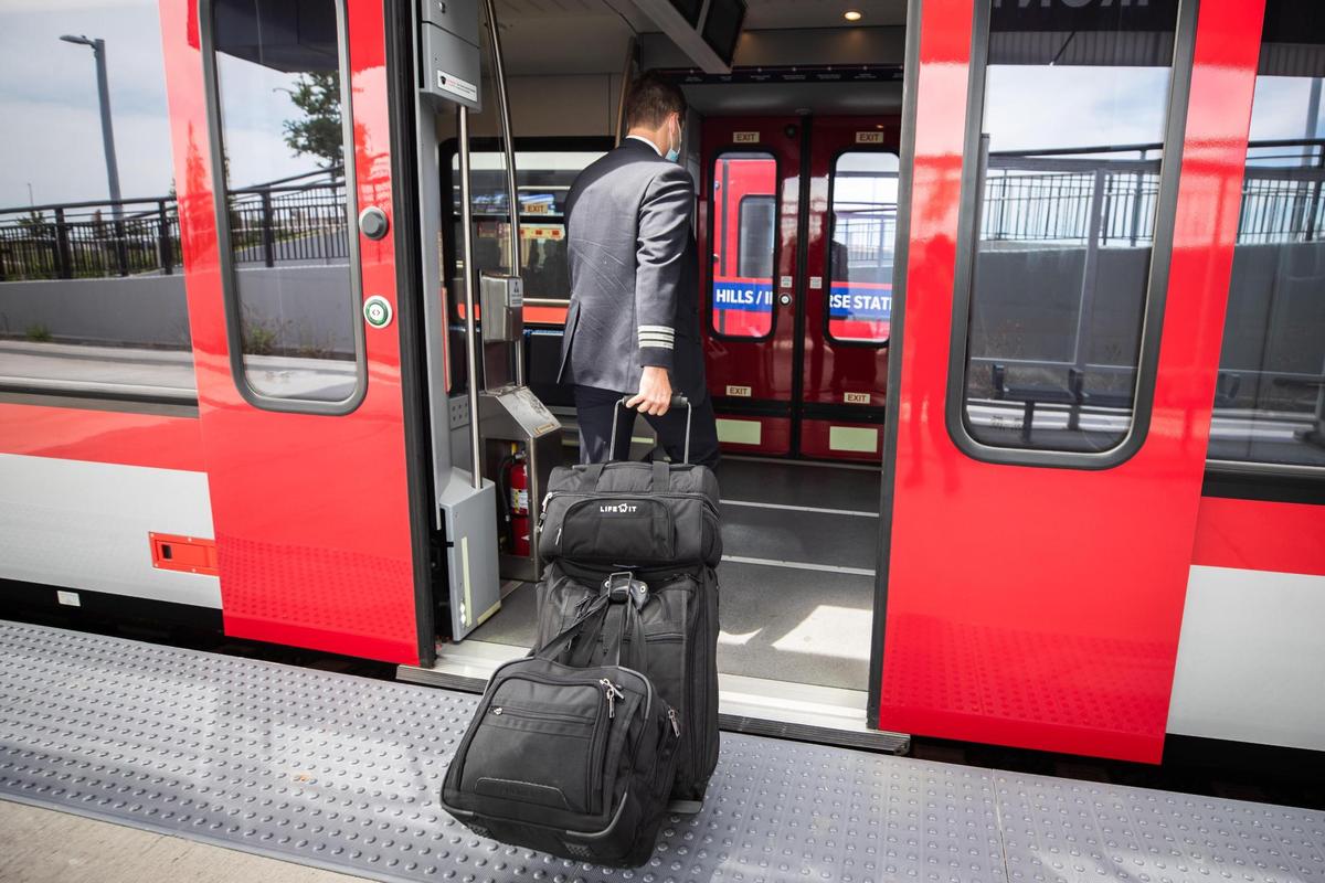 Matthew Ward gets on the TEXRail as he heads to work as a pilot out of DFW Airport Monday, April 19, 2021, at Iron Horse station in North Richland Hills. Ward purchased his home with consideration to its closeness to the station.