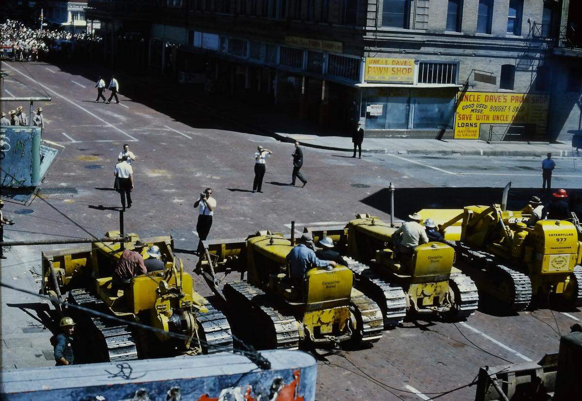 Bulldozers, topped by county commissioners and men who were actually trained to drive bulldozers, lined up on Main Street as photographers documented the scene in preparation for the mass demolition project in 1965 to make way for Fort Worth’s convention center.