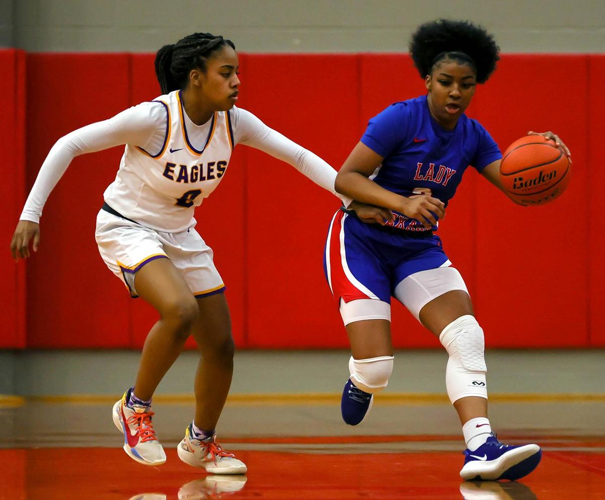 Sam Houston guard Jada Keeling (R) tries to dribble past Richardson guard Nadia Amadi (L) during the first half of the 6A Bi-District Girls Basketball playoff game played at Coppell High School, February 12, 2021. (Steve Nurenberg Special to the Star-Telegram)