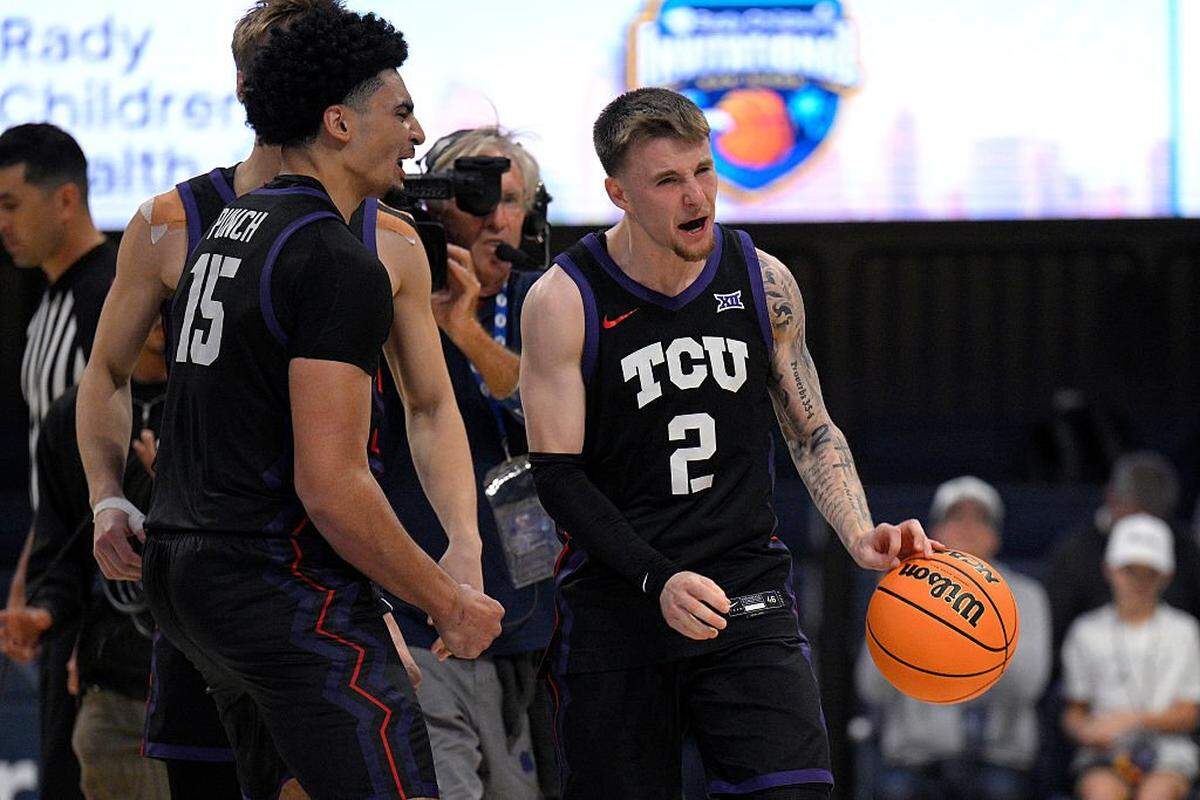 SAN DIEGO, CALIFORNIA - NOVEMBER 27: Brock Harding #2 and David Punch #15 of the TCU Horned Frogs celebrate after defeating the Florida Gators in the 2025 Rady Children's Invitational at Jenny Craig Pavilion on November 27, 2025 in San Diego, California. (Photo by Orlando Ramirez/Getty Images)