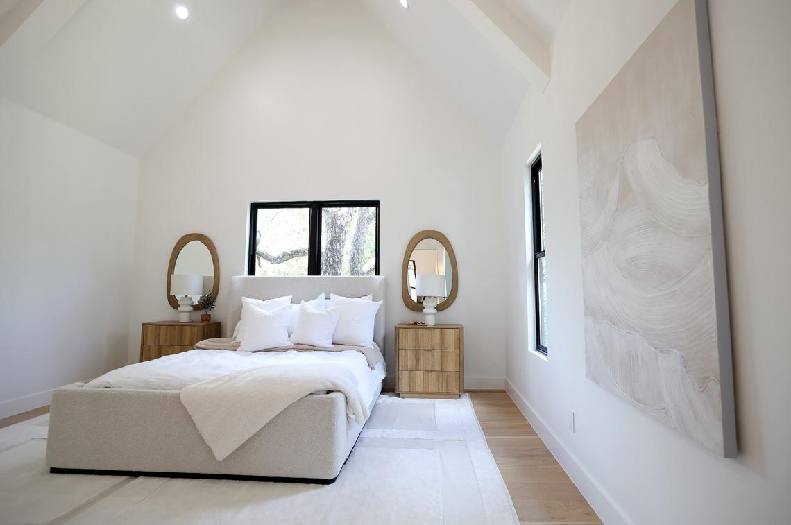 The primary bedroom of a 7,019-square-foot home in the Silverado on the Brazos community on Wednesday, September 11, 2024. The home features six bedrooms and five bathrooms.