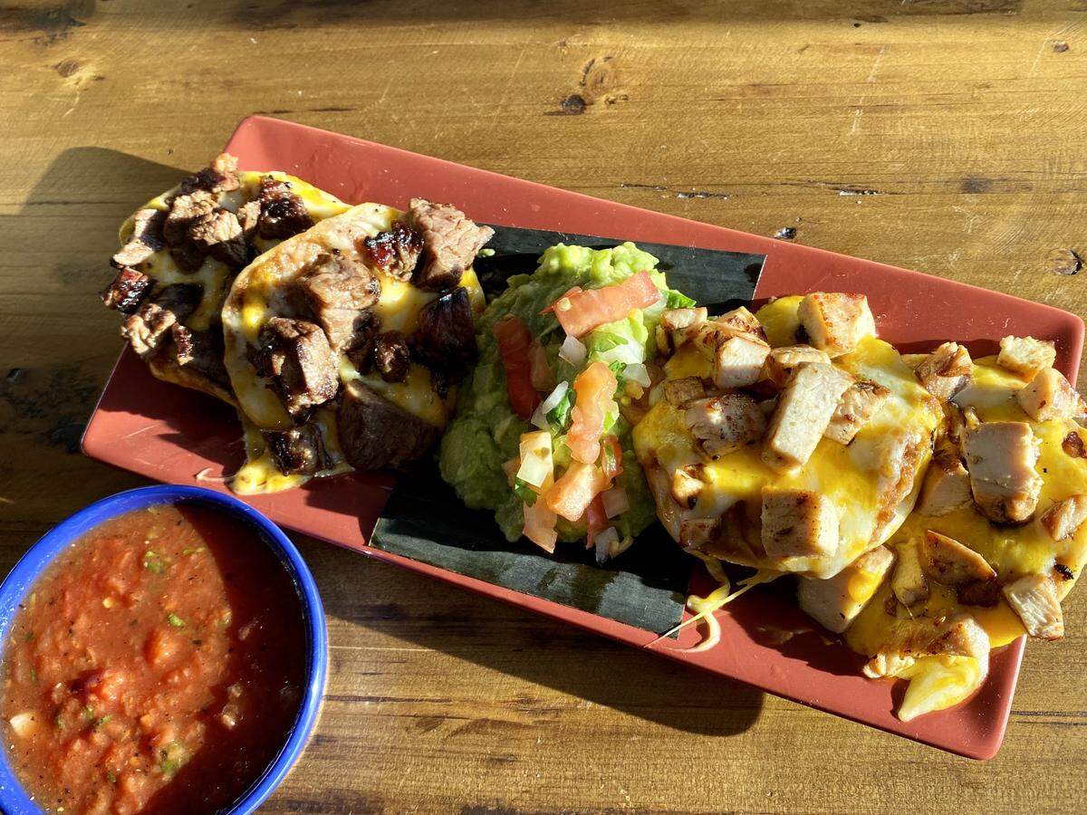 A lunch half-order of nachos with plenty of above-average guacamole at Blue Goose Cantina.