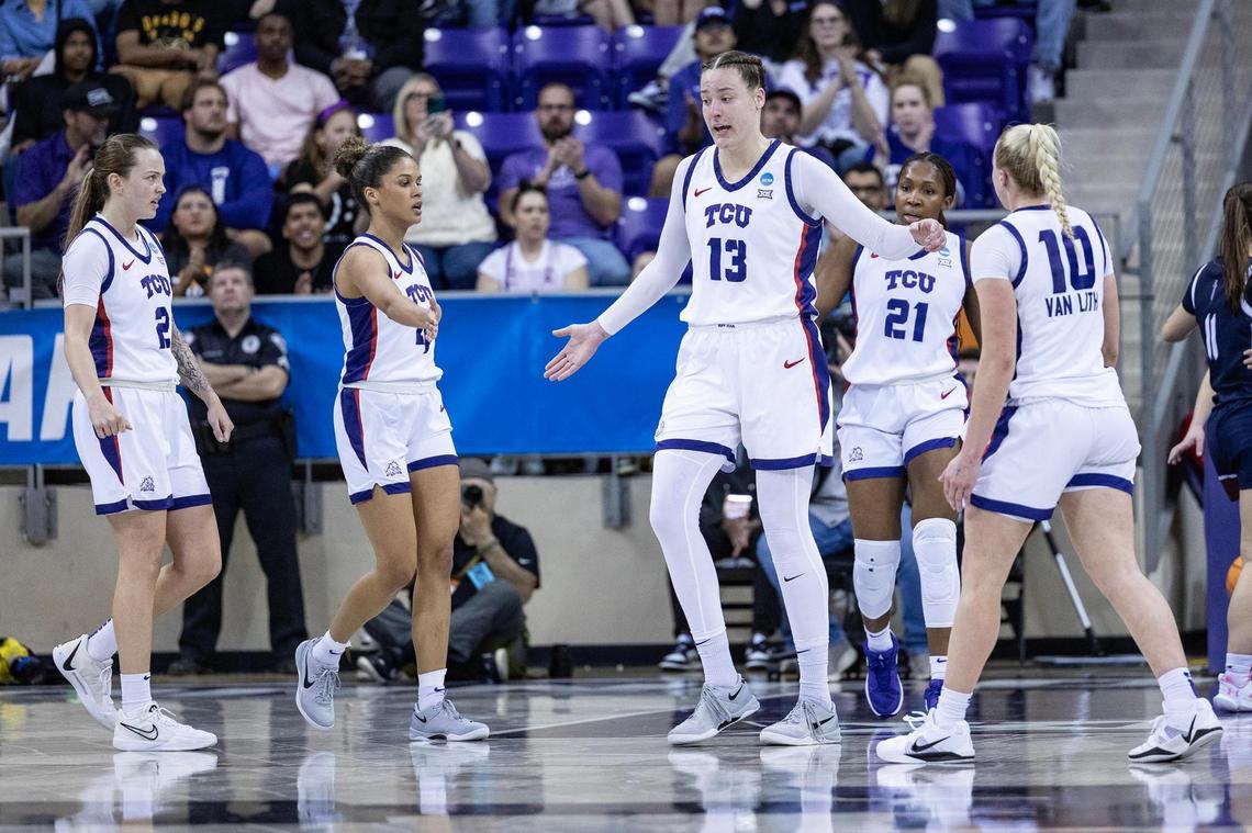 TCU center Sedona Prince (13) celebrates with her teammates after making a layup with a foul in the first half of the first round of the Women’s NCAA Championships Tournament game between TCU and Fairleigh Dickinson at Schollmaier Arena in Fort Worth on Friday, March 21, 2025.