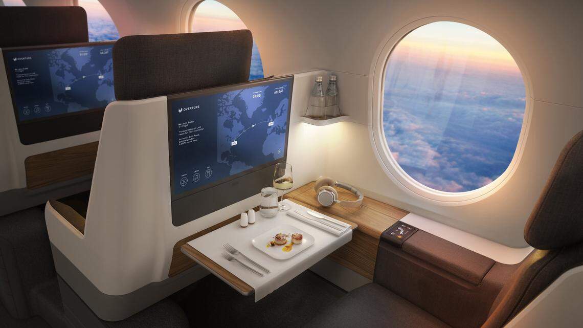 A rendering of the inside of an Overture jet shows passenger space for work or relaxation, an entertainment screen and personal window.