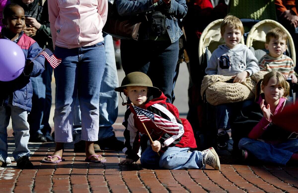 Nov. 11, 2006: Zak Kilpatrick, 6, of Bedford watches the Veterans Day parade as it move along Main Street in downtown Fort Worth. on Saturday, November 11, 2006.