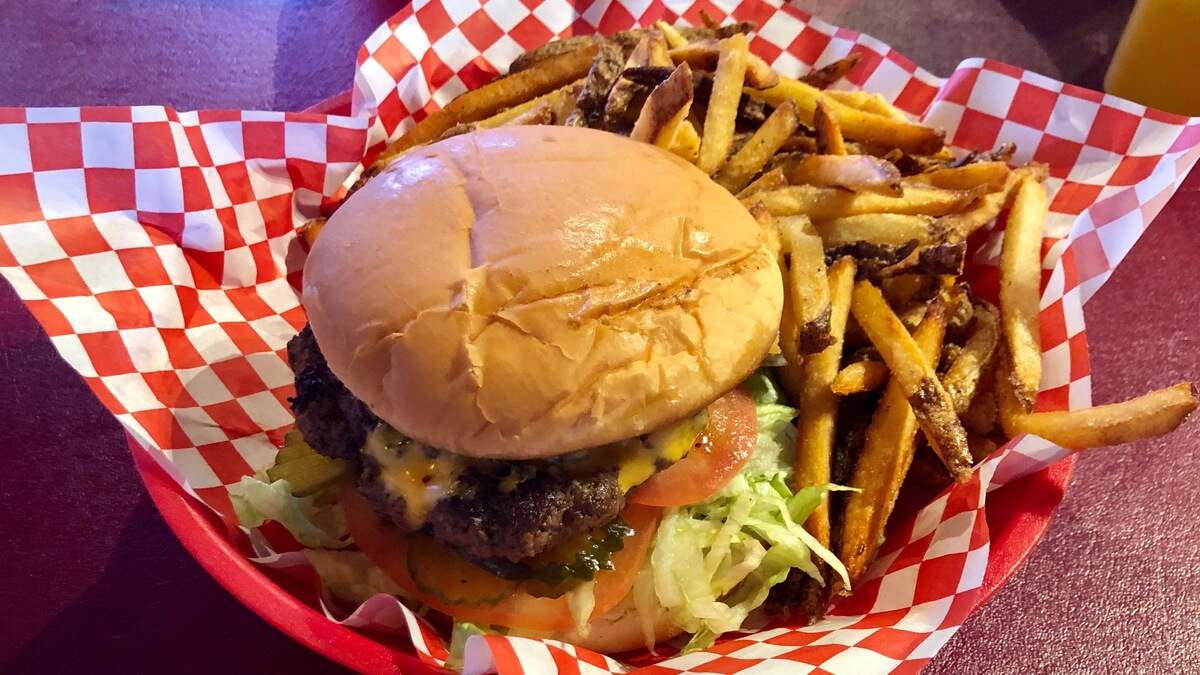 A half-pound, hand-packed “Classic Chubby” burger with fries at Chubby’s Burger Shack.