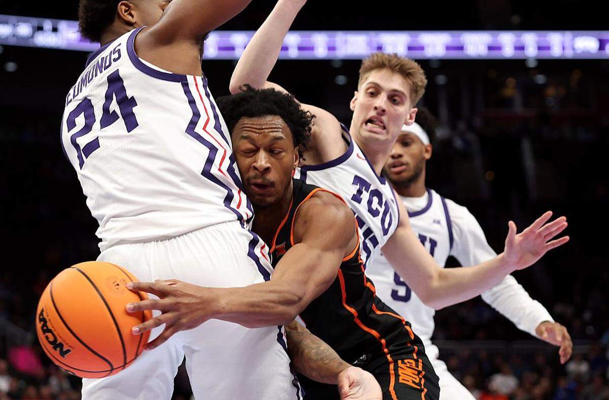 KANSAS CITY, MISSOURI - MARCH 11: Anthony Roy #9 of the Oklahoma State Cowboys collides with Xavier Edmonds #24 of the Texas Christian University Horned Frogs during the second round game of the Men's 2026 Big 12 Tournament at T-Mobile Center on March 11, 2026 in Kansas City, Missouri. (Photo by Jamie Squire/Getty Images)