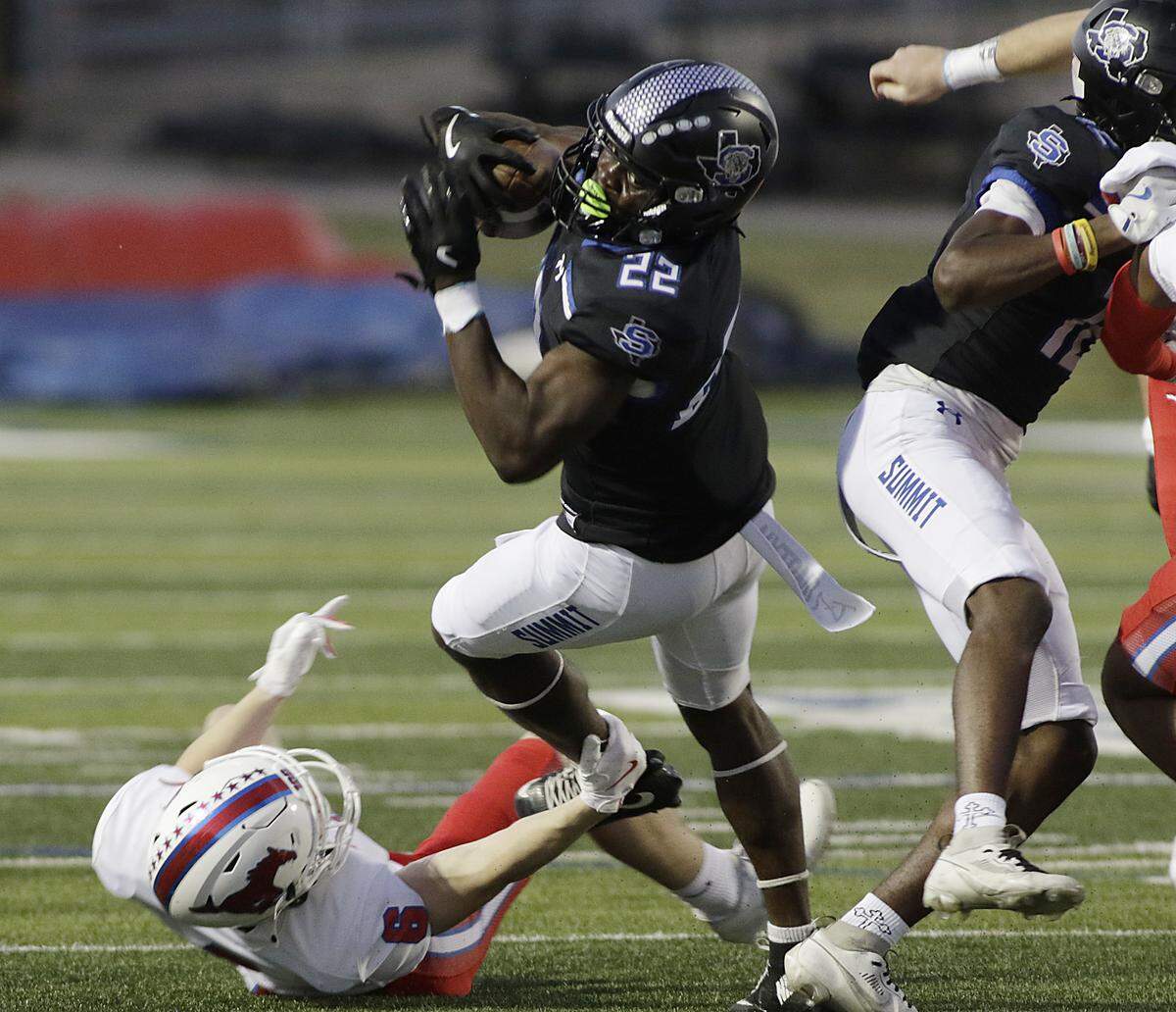 Summit’s Omogbolaha Daudu dives for extra yardage against  Grapevine during their game at Newsom Stadium on Thursday, Sep. 25 ,2025 