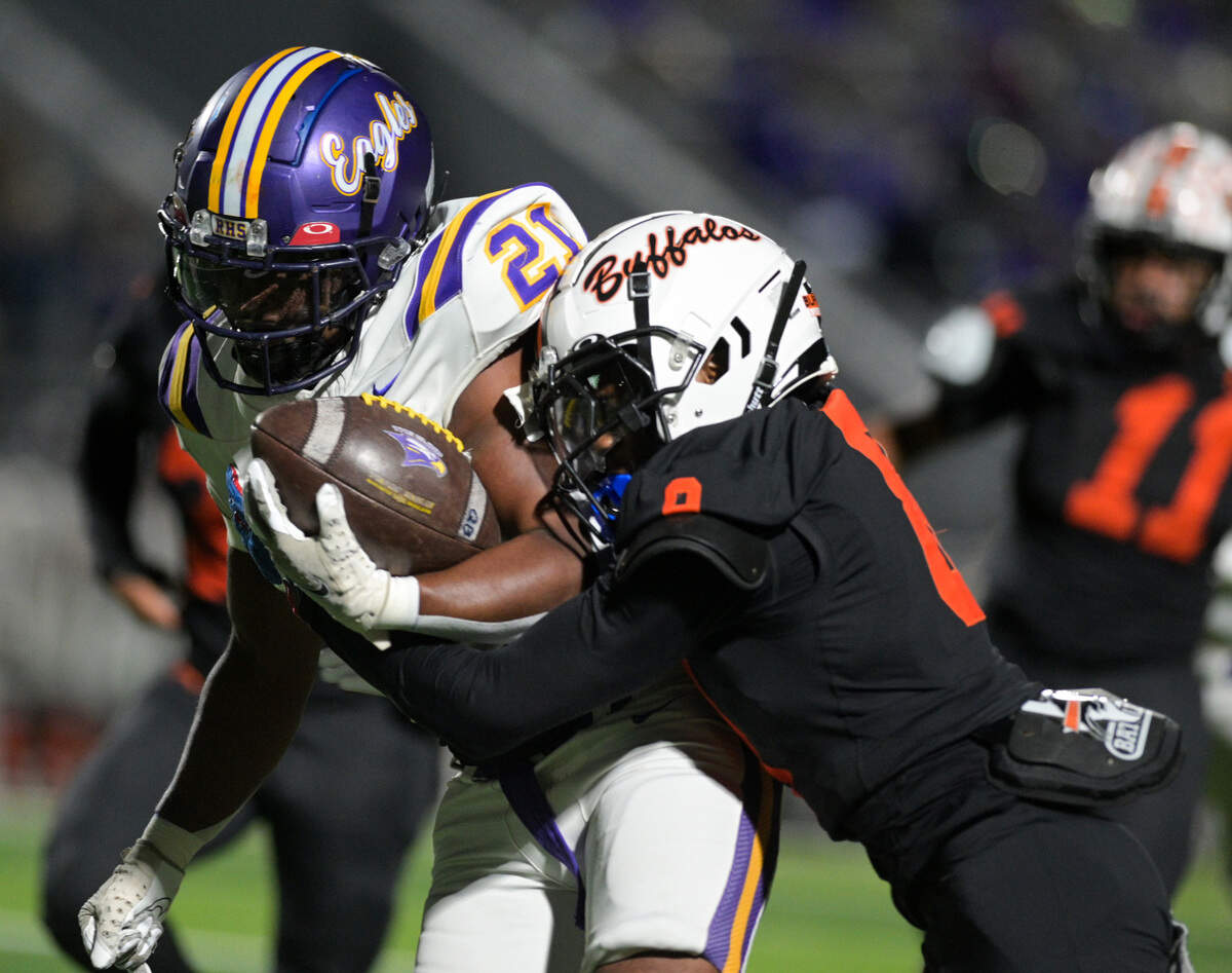 Richardson running back Kevin Willingham Jr. (21) gets tackled by Haltom defensive back Amaree Jackson (8) during a UIL bi-district playoff football game at Birdville ISD FA/AC in North Richland Hills, Texas on Friday, Nov. 15, 2024.