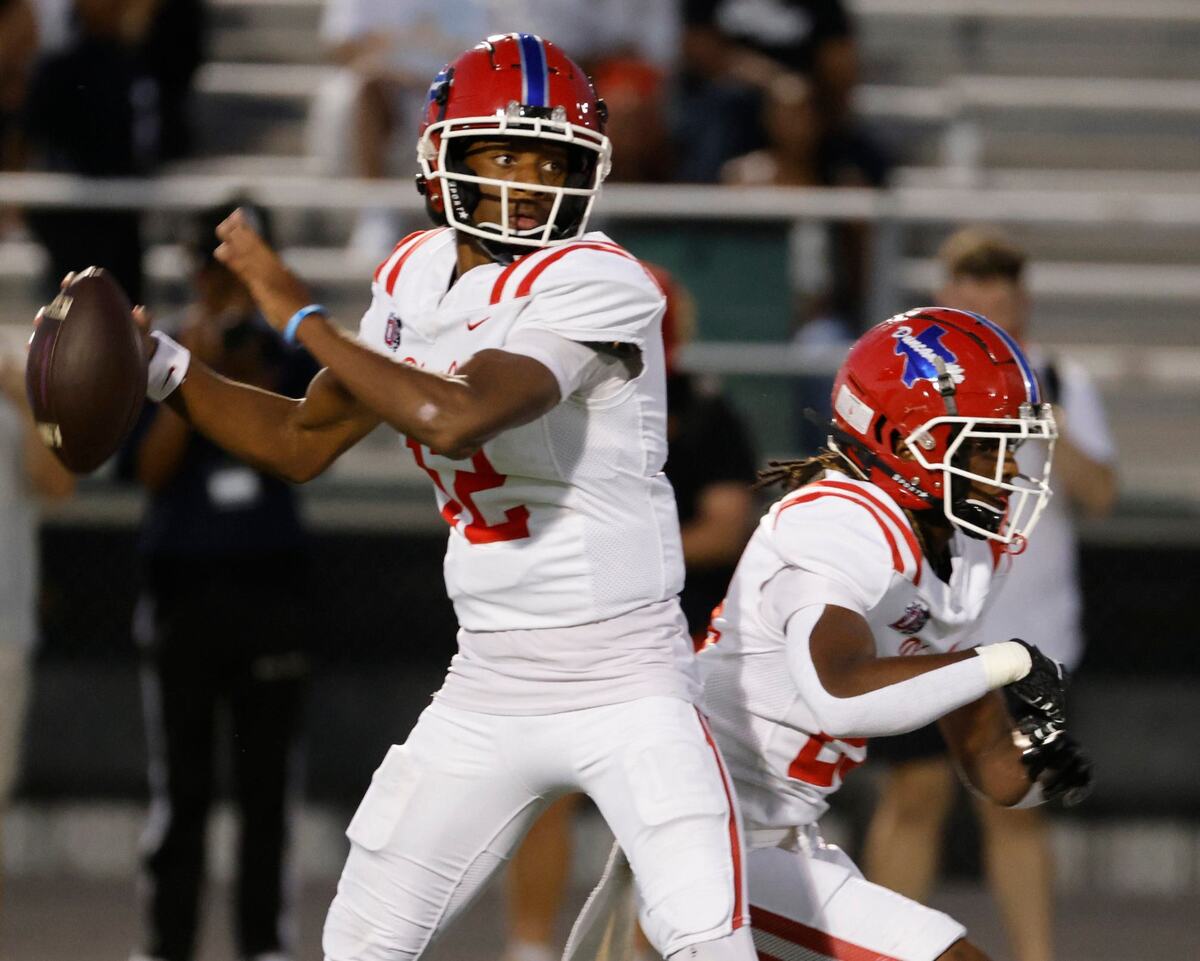Duncanville quarterback Keelon Russell (12) throws out to the right flat during a District 11-6A football game at Eagle Stadium in DeSoto, Texas, Friday, Oct. 11, 2024.
