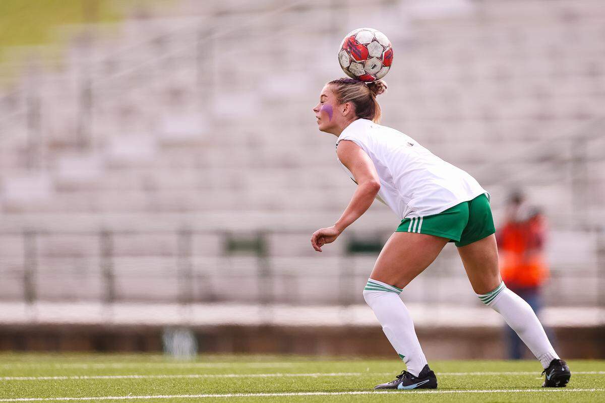Southlake Carroll midfielder Brady Burtnett (10) attempts to head the ball against Forney in a UIL Class 6A Division 2 girls soccer state semifinal on Saturday, April 4, 2026, at Memorial Stadium in Mesquite, Texas.