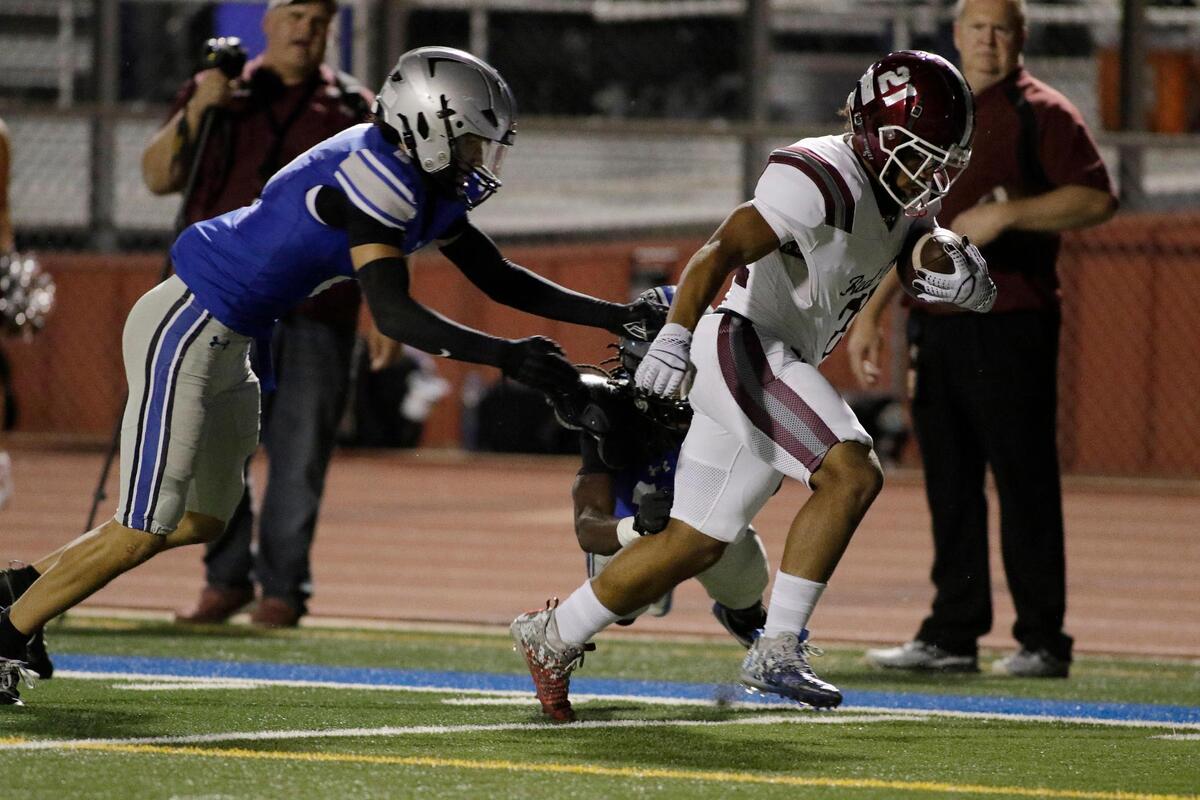 Red Oak’s Lorenzo Holman powers through a tackle by Burleson defenders for a touchdown during a UIL football game at Burleson ISD Stadium on Friday October 25, 2024.