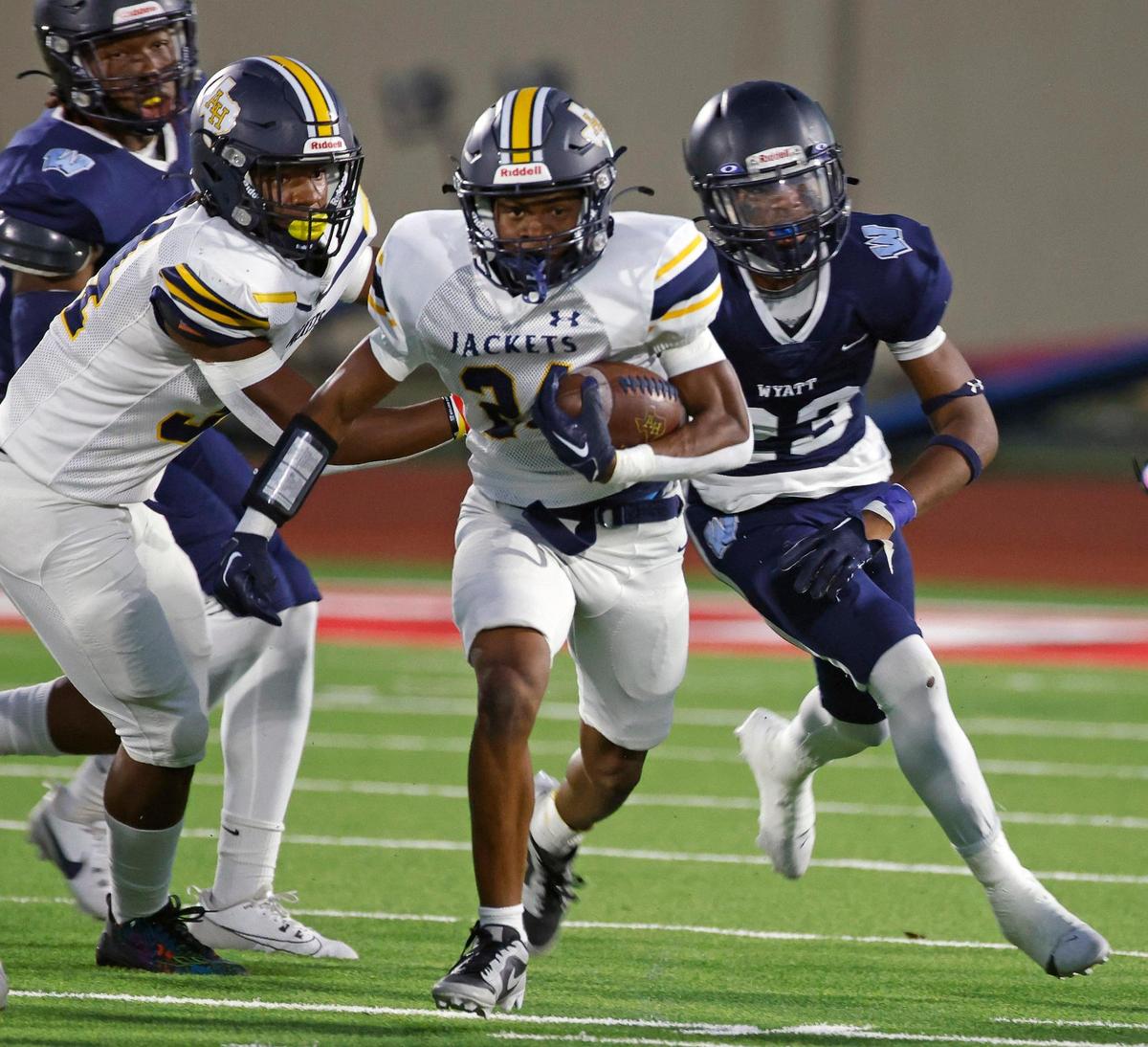 Height’s Latreal Brooks finds room up the middle in the first half of a UIL football game at Clark Stadium in Fort Worth, Texas, Friday, Sept. 29, 2023.
