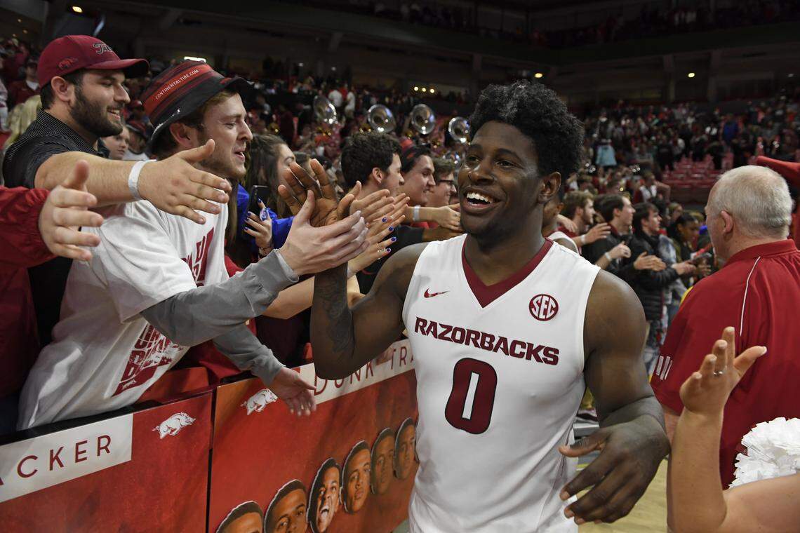 Arkansas guard Jaylen Barford celebrates with fans after the Razorbacks beat Auburn 91-82 during an NCAA college basketball game Tuesday, Feb. 27, 2018, in Fayetteville, Ark.