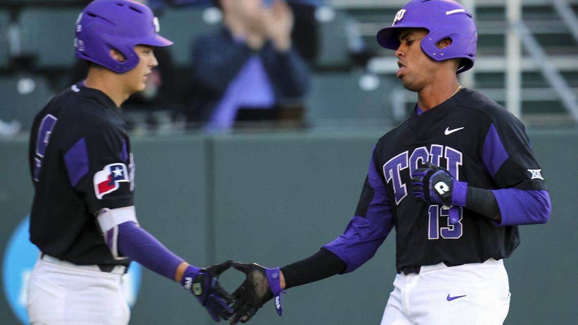 TCU's Connor Shepherd, left, greets Michael Landestoy who scored on a double by Adam Oviedo in the bottom of the third inning against Arkansas-Pine Bluff in the Horned Frogs' 7-1 win Tuesday night at Lupton Stadium.