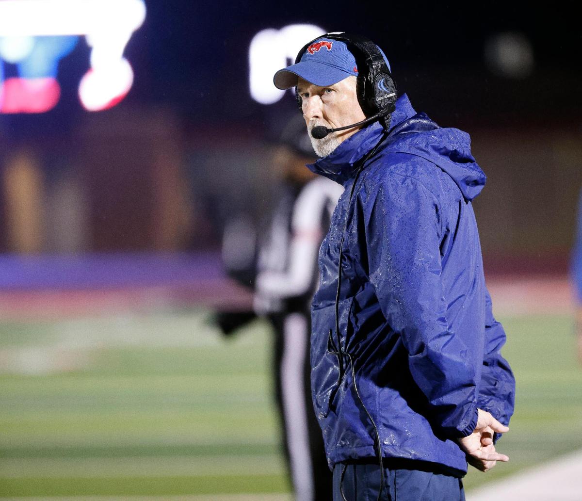 Grapevine head coach Bob DeBesse looks down the sidelines in the first half of a UIL 5A D2 football playoff game at Mustang Panther Stadium in Grapevine, Texas, Thursday, Nov. 09, 2023.