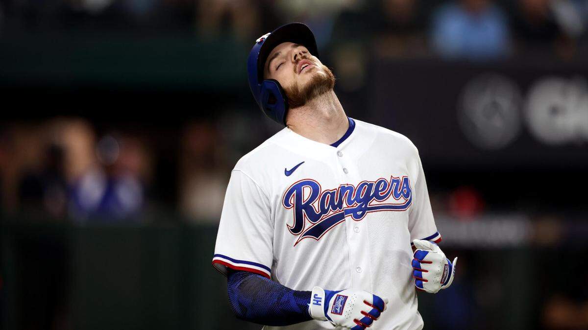 Texas Rangers catcher Jonah Heim reacts after flying out in the fifth inning of Game 3 of the ALCS at Globe Life Field in Arlington on Wednesday, October 18, 2023.