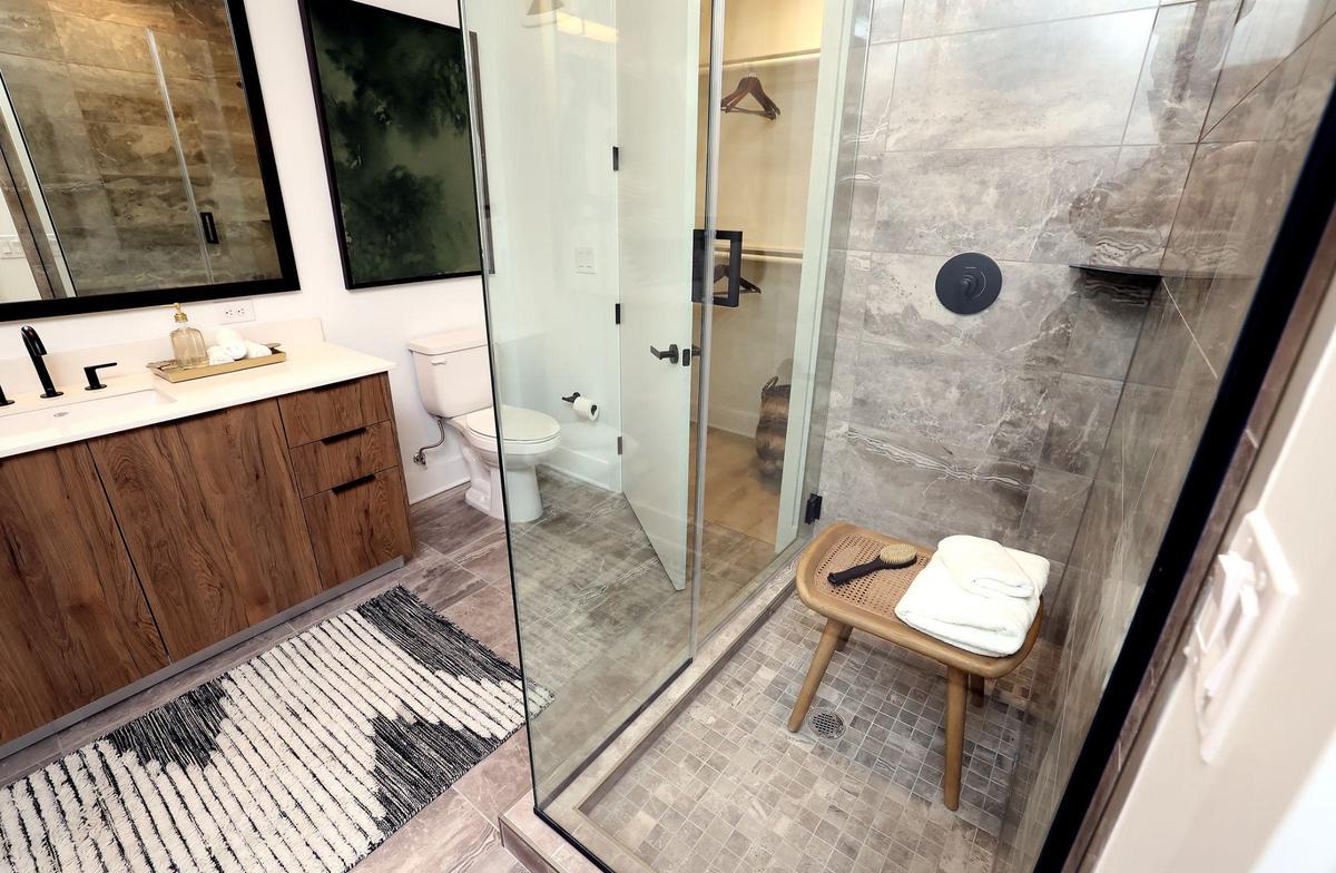 A bathroom of a Crescent Residences model unit on Wednesday, Sept. 4, 2024. There are 168 units in the luxury apartment complex that is part of the Cultural District’s Crescent development.