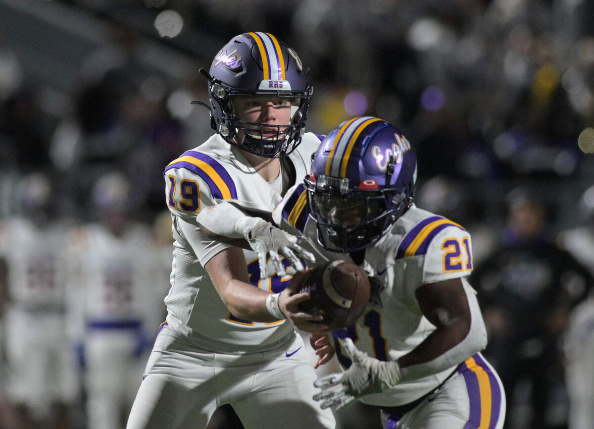 Richardson quarterback Lucas Sawyer (19) hands the ball off to running back Kevin Willingham Jr. (21) during a UIL bi-district playoff football game against Haltom at Birdville ISD FA/AC in North Richland Hills, Texas on Friday, Nov. 15, 2024.
