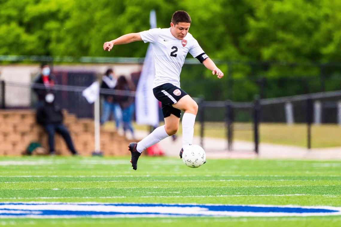 Hector Ramirez (2) receives a kick during the 4A state final between Fort Worth Diamond Hill-Jarvis and Boerne at Birkelbach Field in Georgetown Texas, on April 17th 2021. Photo by Matt Smith (Special to the Star-Telegram).