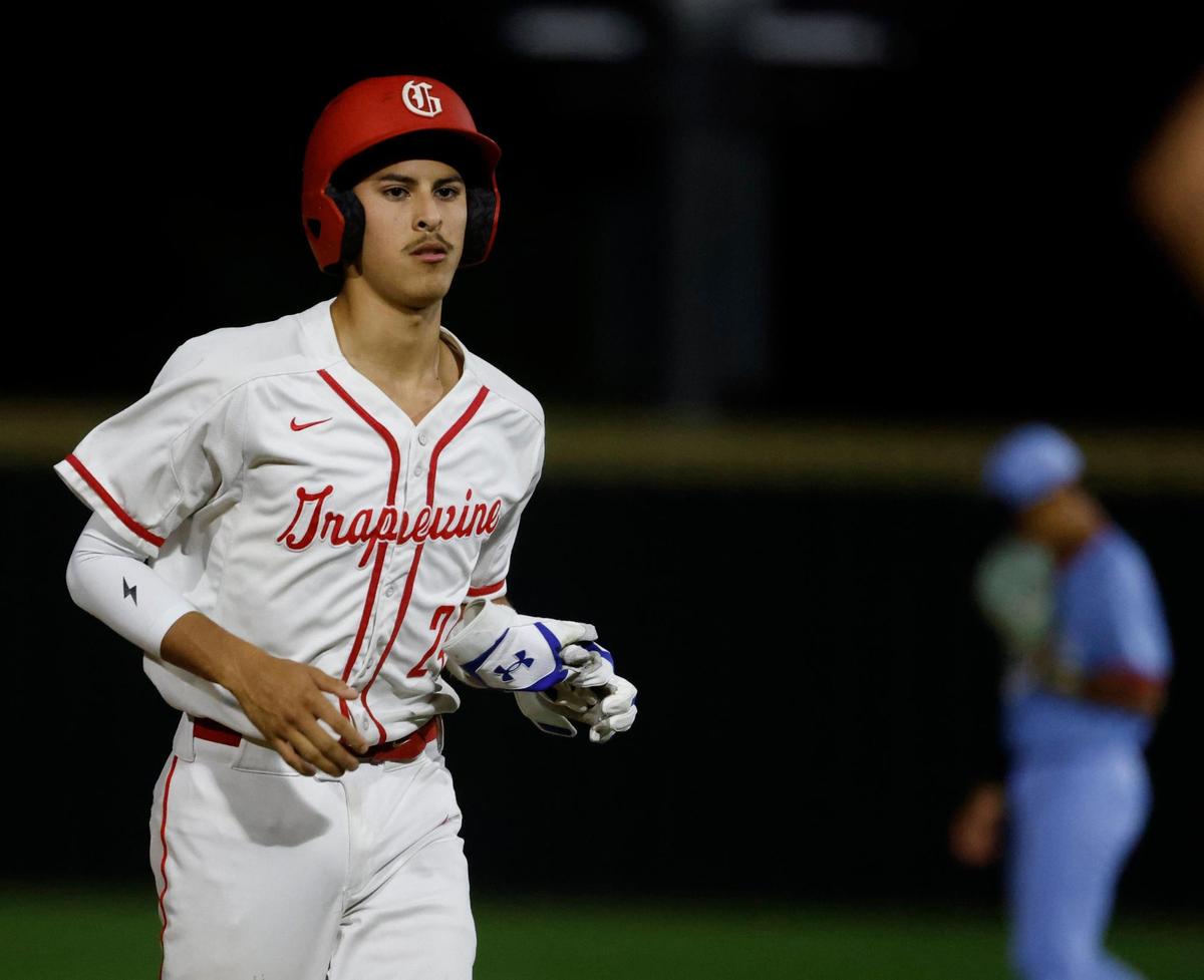 Grapevine catcher Gianni Corral (24) heads to the dugout after being replaced by a pinch runner during a UIL baseball game at Grapevine Mustang Field in Grapevine, Texas, Thursday, Apr. 17, 2025.