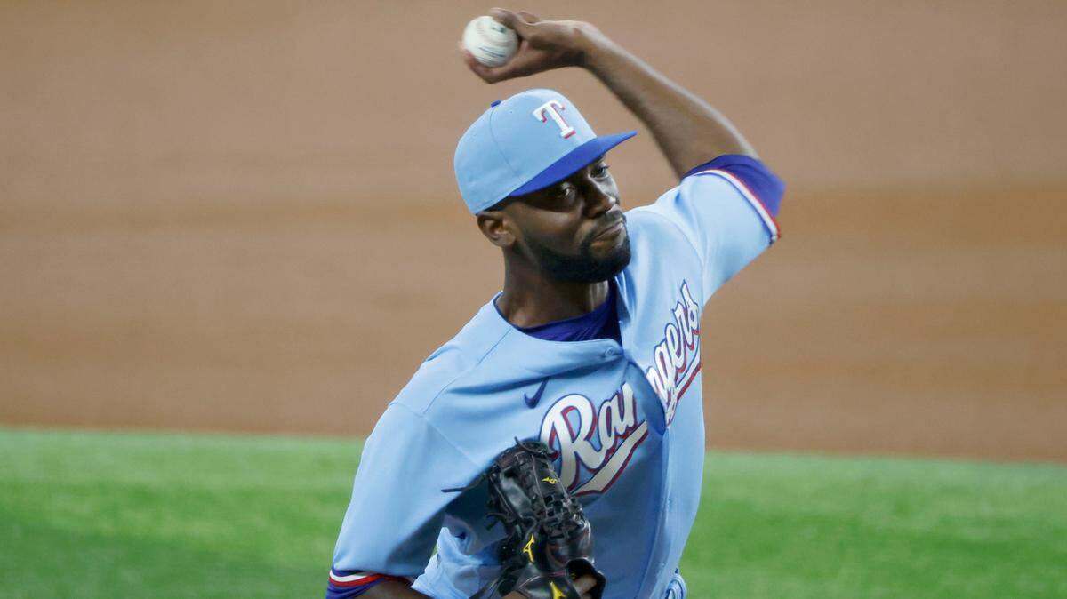 Texas Rangers starting pitcher Taylor Hearn throws against the Houston Astros during the first inning of a baseball game Sunday, Aug. 29, 2021, in Arlington, Texas. (AP Photo/Michael Ainsworth)
