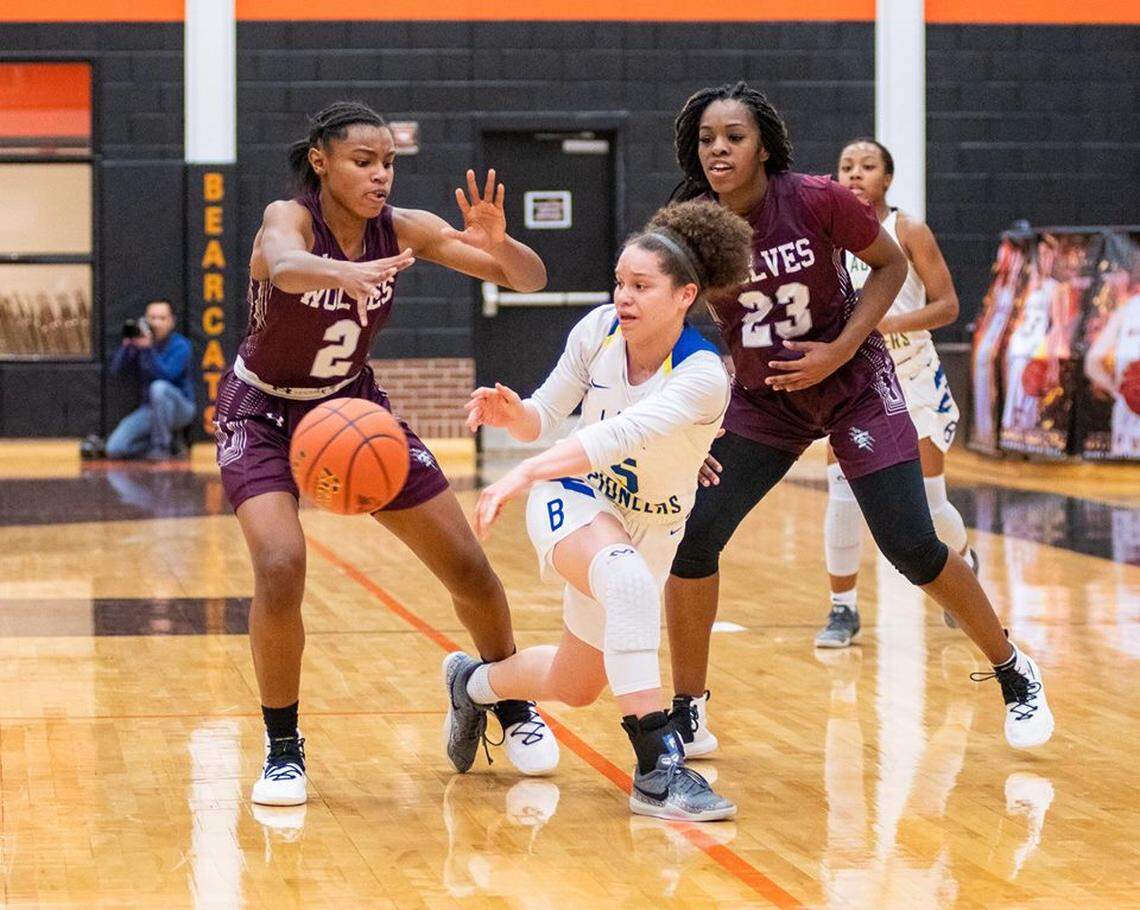 Timberview’s Destiny Jackson (left) and Mikayla Hutchinson defend Boswell’s Jada Russell in a regional quarterfinal game, Monday Feb. 18, 2019 from Aledo HS. Timberview won 68-46.