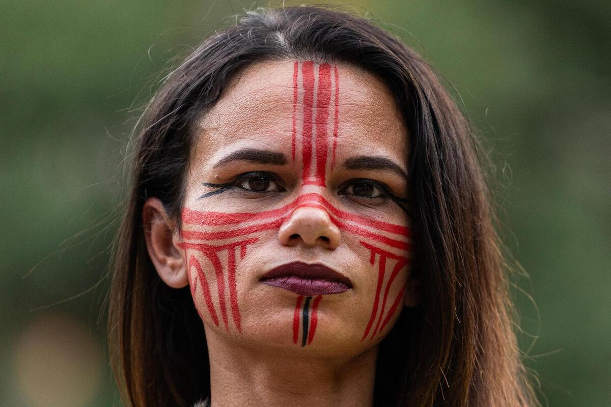 Fort Worth resident Chasity Whitlock wears the traditional Native American face paint of her South Texas Tribe during the ‘Good Trouble’ rally in Burk Burnett Park in downtown Fort Worth on Thursday, July 17, 2025.