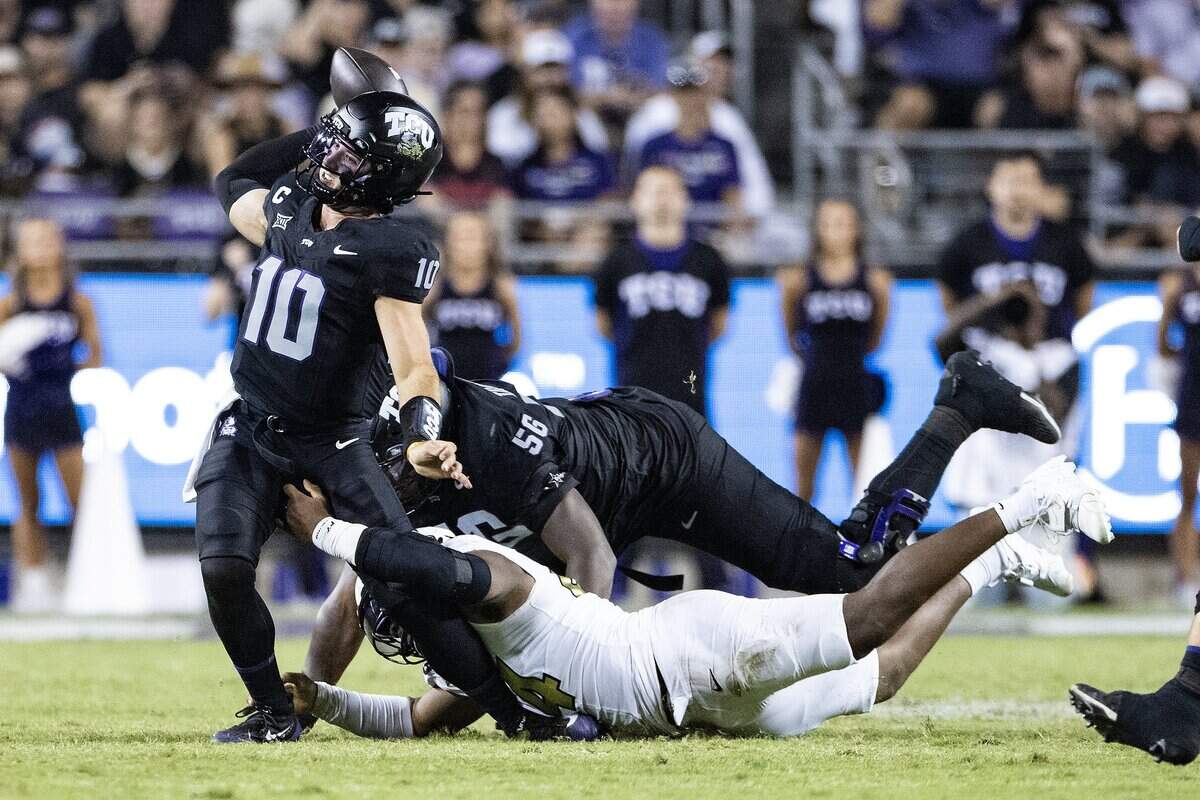 TCU quarterback Josh Hoover (10) is almost sacked in the back field in the seocnd half of an NCAA football game between TCU and Colorado at Amon G. Carter Stadium in Fort Worth on Saturday, Oct. 4, 2025. TCU defeated Colorado 35-21.
