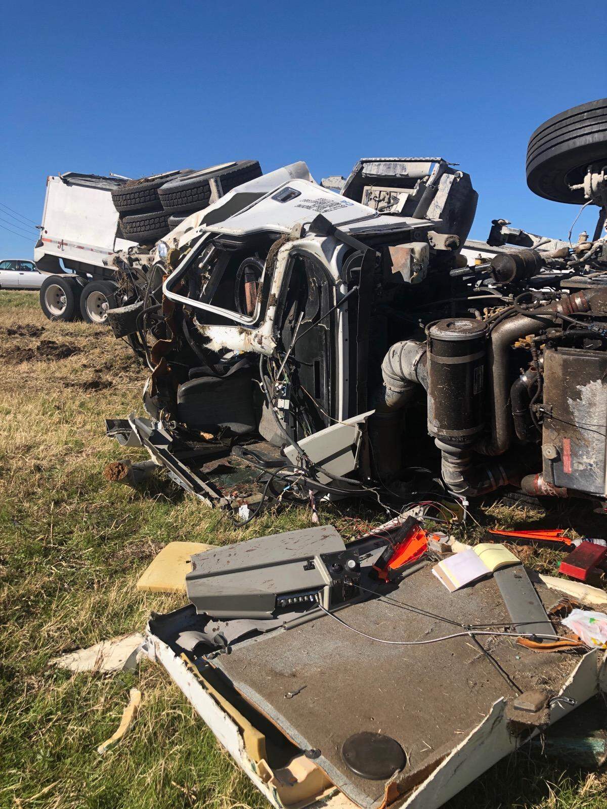 Police say a pickup truck cut this semi off on Texas 121, causing it to roll over.