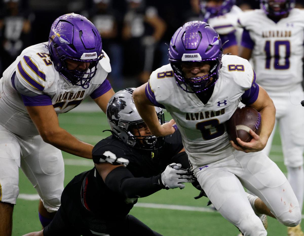 Alvarado running back D.J. Clampitt (8) gets some tough yards up the middle during a UIL 4A D1 Area round football playoff game at The Ford Center in Frisco Texas, Thursday, Nov. 21, 2024.