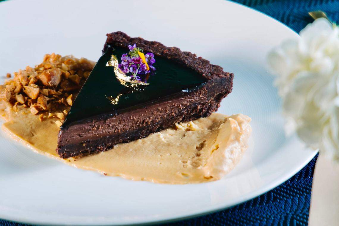 A dark chocolate tart with hazelnut crush and peanut butter mousse is one of three dessert choices through Aug. 25 for Restaurant Week at Wicked Butcher in Fort Worth.